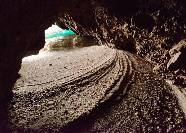 Wide angle shot of Sykia Cave sinkhole and entrance in Melos Island, Greece